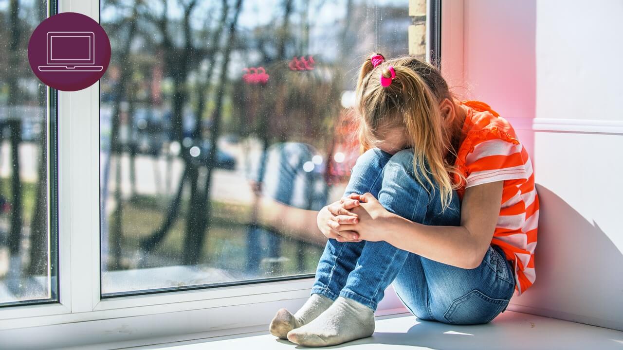 anxious child sitting in window
